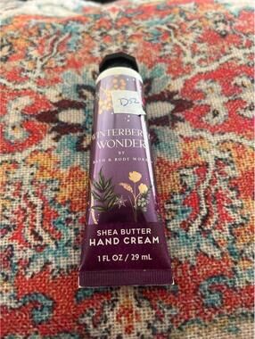 D52  1 Bath and Body Works hand cream 1 oz winterberry wonder